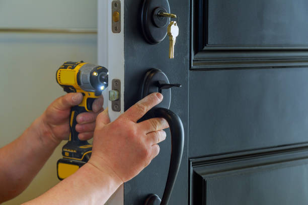 man is installing a deadbolt lock